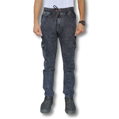 Person wearing dark gray cargo pants on a white background