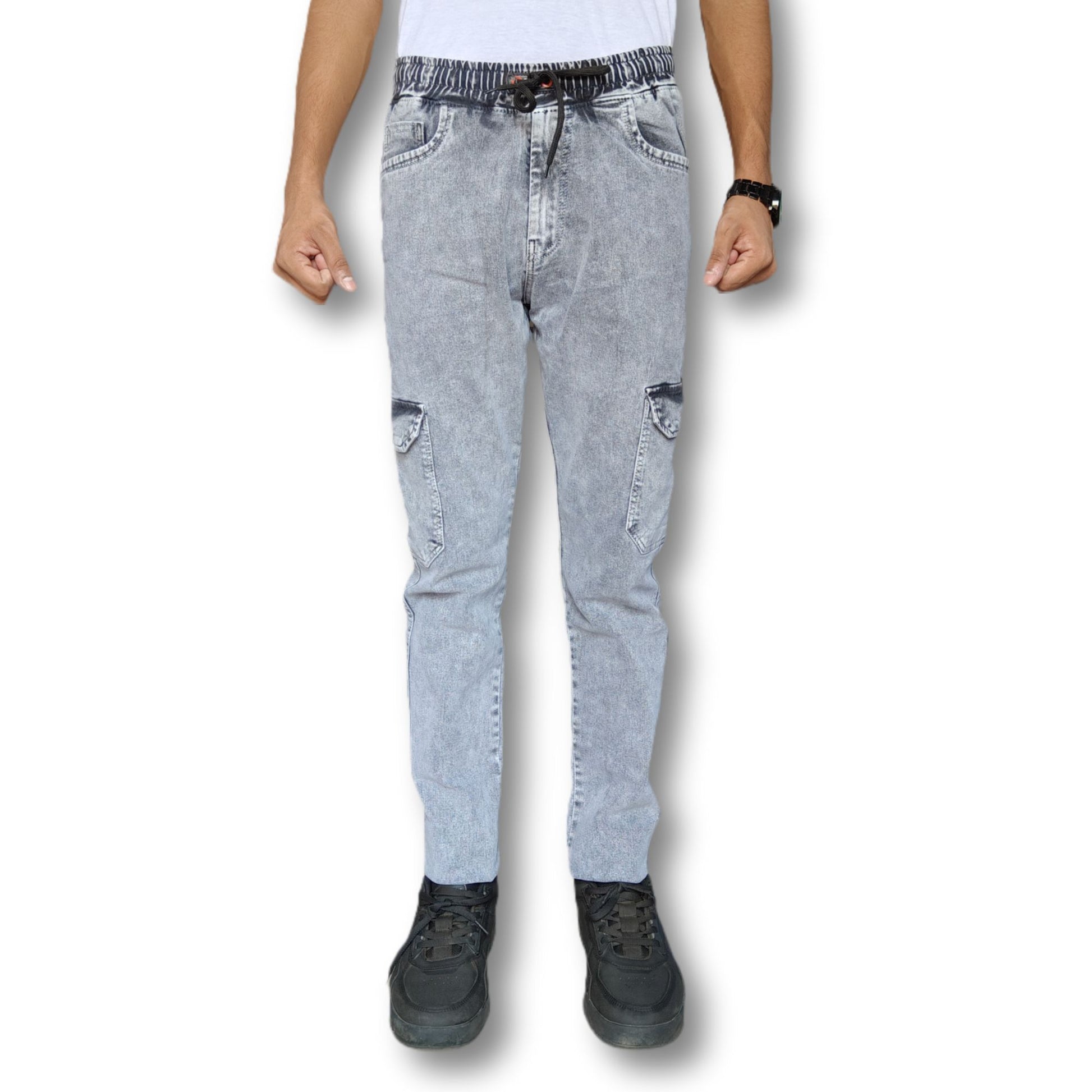 Light grey denim cargo joggers worn by a person on a white background